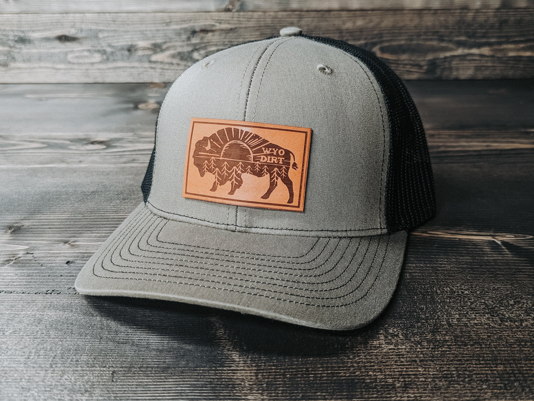 We The Essentials Camo Trucker Hat with Leather Patch