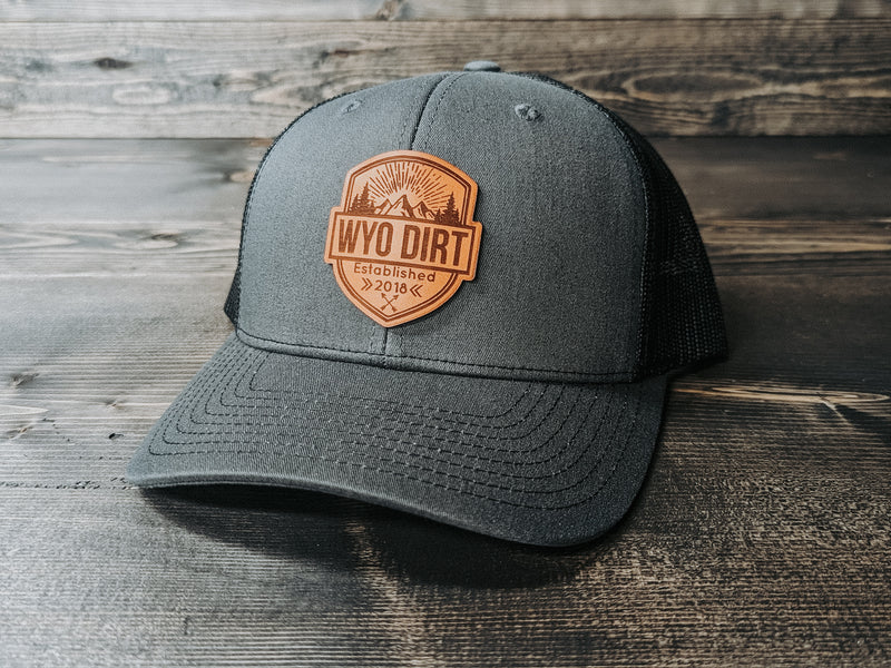 Wyo Dirt Badge: Leather Patch Trucker Hat - Wyo Dirt Customs